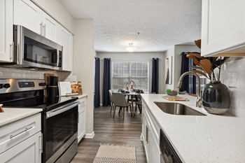 Renovated, white cabinets, quartz countertops, hard surface floors throughout